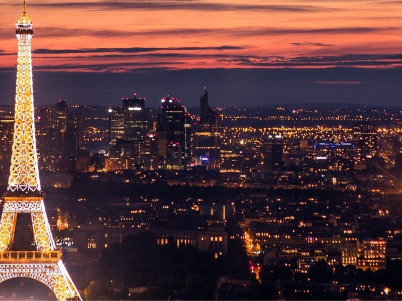 The Eiffel Tower illuminated at night in Paris, France.